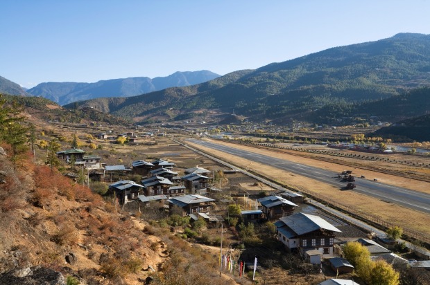 PARO, BHUTAN. Bhutan's only international airstrip, Paro Airport sits in a serpentine river valley shadowed by mountains ...
