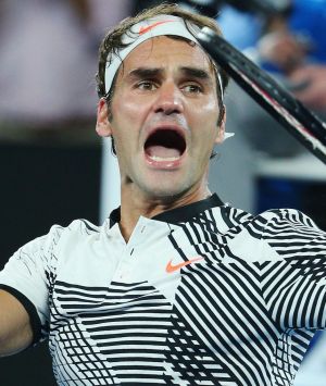 Roger Federer celebrates winning in his fourth-round match against Kei Nishikori.