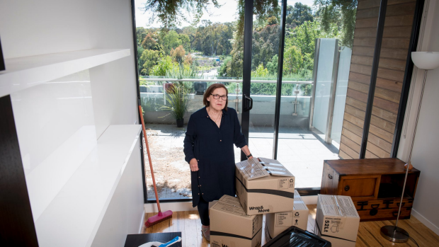 Julie Gaffney in her luxury Abbotsford apartment she believes is too dangerous to live in.