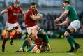 George North crashes through the Irish defence at the Aviva Stadium on Sunday.