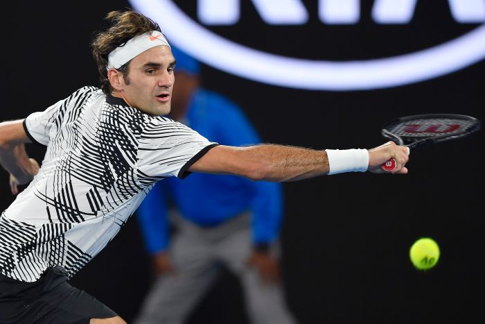 Roger Federer returns against Kei Nishikori