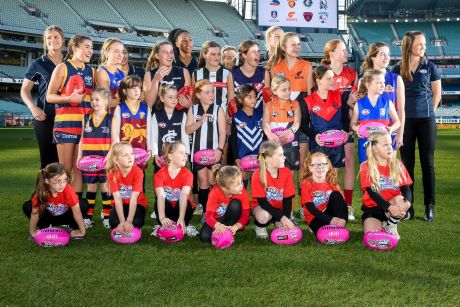 Daisy Pearce (far right) with fellow players and potential future stars at the launch of the league.