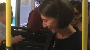 Gladys Berejiklian alights the 205. 