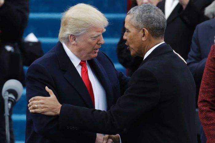 Donald Trump shakes hands with Barack Obama