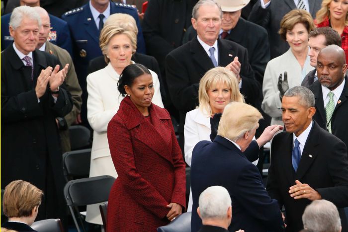 Hillary Clinton watches the swearing-in ceremony for Donald Trump at the US Capitol.