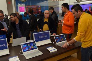 customers rush inside the Microsoft store in Toronto for information or to purchase items for their development