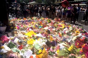 Two days after a car drove through Bourke Street, killing five, flowers are left for the victims. (ABC News: James Hancock)