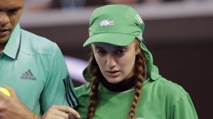 Jo-Wilfried Tsonga helps injured ballgirl Giuliana off the court at last year's Australian Open.