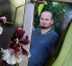 Darren Galea, in a photo alongside an orchid at his father's home, lived a quiet life and had few social connections.
