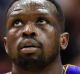 Los Angeles Lakers forward Luol Deng (9) walks toward the bench during the second half of an NBA basketball game against ...