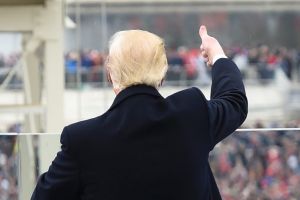 President Donald Trump acknowledges the crowd during the presidential inauguration on Capitol Hill in Washington, ...