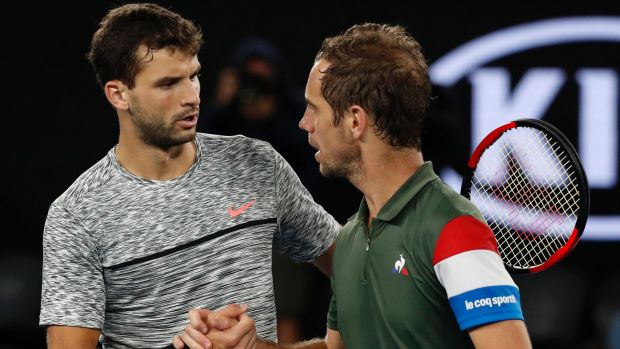 Winner Dimitrov (left) is congratulated by Gasquet