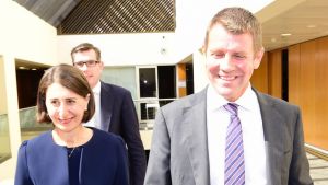 Mike Baird and Gladys Berejiklian arrive for the Liberal Party meeting on Monday.