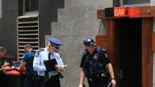 Police at the scene of the fatal shooting during filming in Brisbane's Eagle Lane.