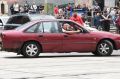 The car doing burnouts at the junction of Flinders and Swanston street.