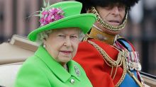 The Queen and Prince Philip ride in a carriage during the Trooping The Colour parade at Buckingham Palace in London on ...