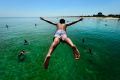 Get set to swelter, or find a way to cool off - like this young man at the Frankston Jetty.