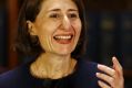 Gladys Berejiklian smiles at a press conference on Monday. 