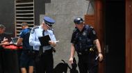 Police at the scene of the fatal shooting during filming of the Bliss n Eso music video in Brisbane's Eagle Lane.