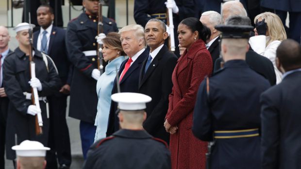 Out with the old: Former President Barack Obama and his wife Michelle stand with President Donald Trump and first lady ...