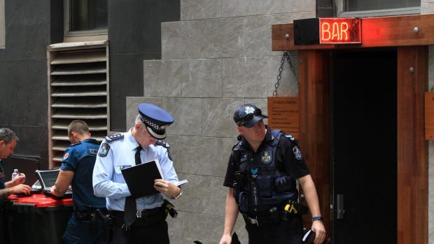Police at the scene of the fatal shooting during filming of the Bliss n Eso music video in Brisbane's Eagle Lane.