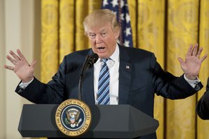 President Donald Trump speaks during a White House senior staff swearing in ceremony in the East Room of the White House, Sunday, Jan. 22, 2017, in Washington.