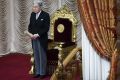 Japanese Emperor Akihito stands in front of the chrysanthemum throne at the opening of parliament on Friday.