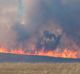 Aircraft dump water over the Tarago fire.