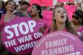 Planned Parenthood supporters attend a September rally in Los Angeles to campaign for access to reproductive health care.