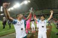 Bruno Fornaroli and Tim Cahill celebrate winning the FFA Cup.