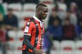 Nice's forward Mario Balotelli, runs with the ball during the League One soccer match between Nice and Lyon, in Nice ...