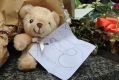 A soft toy with a child's drawing at the Bourke Street memorial.