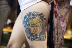 Jennifer Pitta shows off a tattoo of Republican presidential candidate Donald Trump during a campaign rally at ...