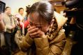 Anguish in Beijing as relatives learn MH370 has gone missing on March 9, 2014.