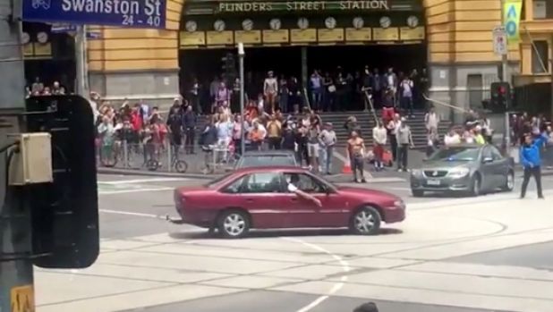 The Holden Commodore was seen doing burnouts outside Flinders St station in the lead-up to the tragedy.