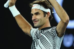 Roger Federer celebrates with the crowd  after his victory.