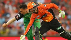 PERTH, AUSTRALIA - JANUARY 24: Scott Boland of the Stars attempts to run out Sam Whiteman of the Scorchers during the ...