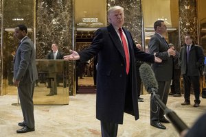 President-elect Donald Trump speaks to members of the media in the lobby at Trump Tower in New York, Tuesday, Dec. 6, 2016.