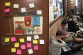 Post-it notes protesting the decision and students blocking the corridors at UWA