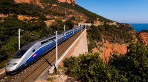 Anth?or, France, September 27, 2014 : A french high speed train TGV running over a viaduct alongside mediterranean ...