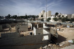 This May 17, 2016 photo shows construction on land owned by Palestinian Mohammad Abu Ta’a, in east Jerusalem. Abu Ta’a discovered some years ago that the Israeli government had expropriated the piece of land in Jerusalem belonging to his family and handed it over to a leading organization that oversees Jewish settlement building in the West Bank.