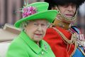 The Queen and Prince Philip ride in a carriage during the Trooping The Colour parade at Buckingham Palace in London on ...
