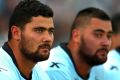 SYDNEY, AUSTRALIA - MARCH 08: (L-R) David and Andrew Fifita take a break on the sideline during the round one NRL match ...