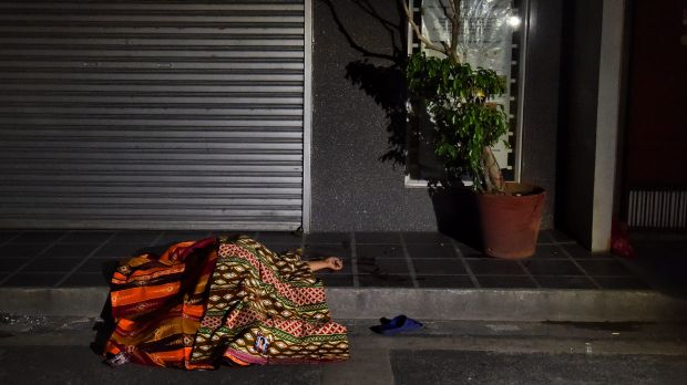 One of two people killed in a double shooting in the Manila suburb of Baclaran, lies in the street.