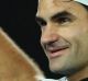 Roger Federer celebrates with the crowd  after his victory.