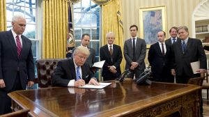 US President Donald Trump signs an executive order reinstating the gag rule prohibiting receivers of aid from discussing ...