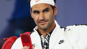 MELBOURNE, AUSTRALIA - JANUARY 16: Roger Federer of Switzerland walks out on court to play in his first round match ...