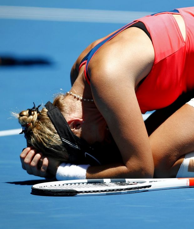 An emotional Mirjana Lucic-Baroni falls to the ground after her win.