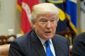 President Donald Trump speaks during his meeting with automobile industry leaders in the Roosevelt Room of the White ...