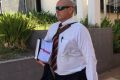 Josh Hoch's solicitor Michael Spearman leaves the Mount Isa Police Station watch house on Wednesday afternoon.